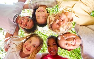 Multicultural children group in circle for friendship and diversity
